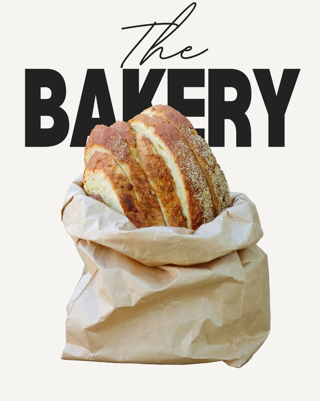 Freshly baked sliced bread in a brown paper bag with bold “The Bakery” text.